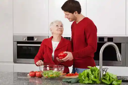 old mother with her son in kitchen=
